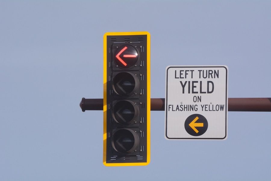 What does a flashing yellow turn arrow mean?
